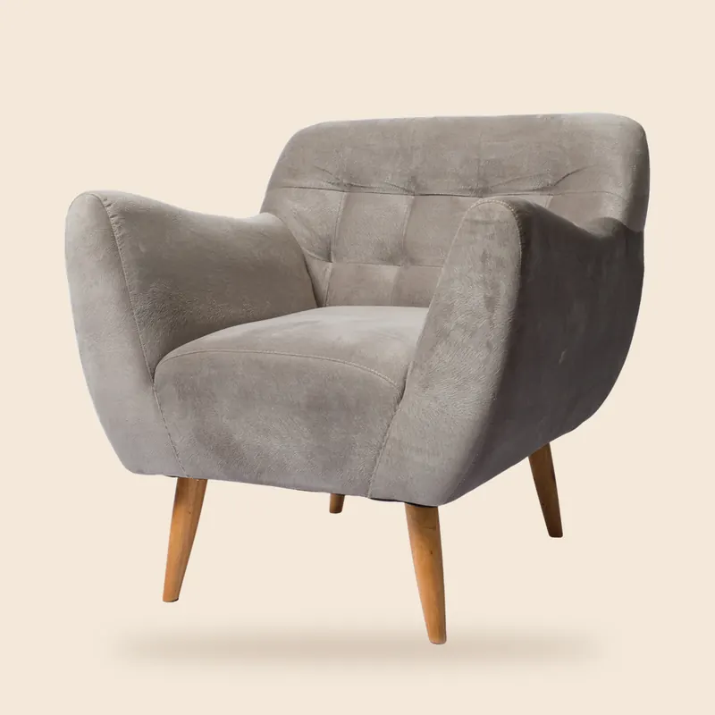 Grey tufted armchair