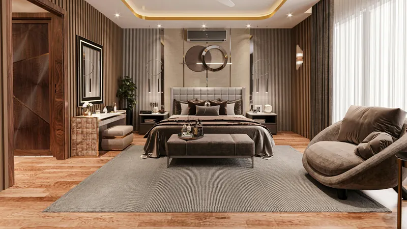 Master bedroom with upholstered bed, wall panelling and a sculpted lounge chair